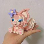 LinaBell building blocks DIY model kit showing the finished pink fox figure next to the product box.