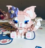 LinaBell building blocks DIY model kit showing the finished pink fox figure next to the product box.