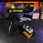 White & Blue BMW M4 1:64 Mini Alloy RC Drift Car by YEGAO with LED headlights, black rear spoiler and 2.4GHz remote controller