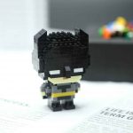 Batman DC Super Hero F3030 Micro Building Blocks mini figure with black cowl, pointed ears, grey suit and yellow belt