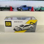 BMW M4 GT3 white 1:64 diecast racing car with large rear wing and metal chassis – CCA