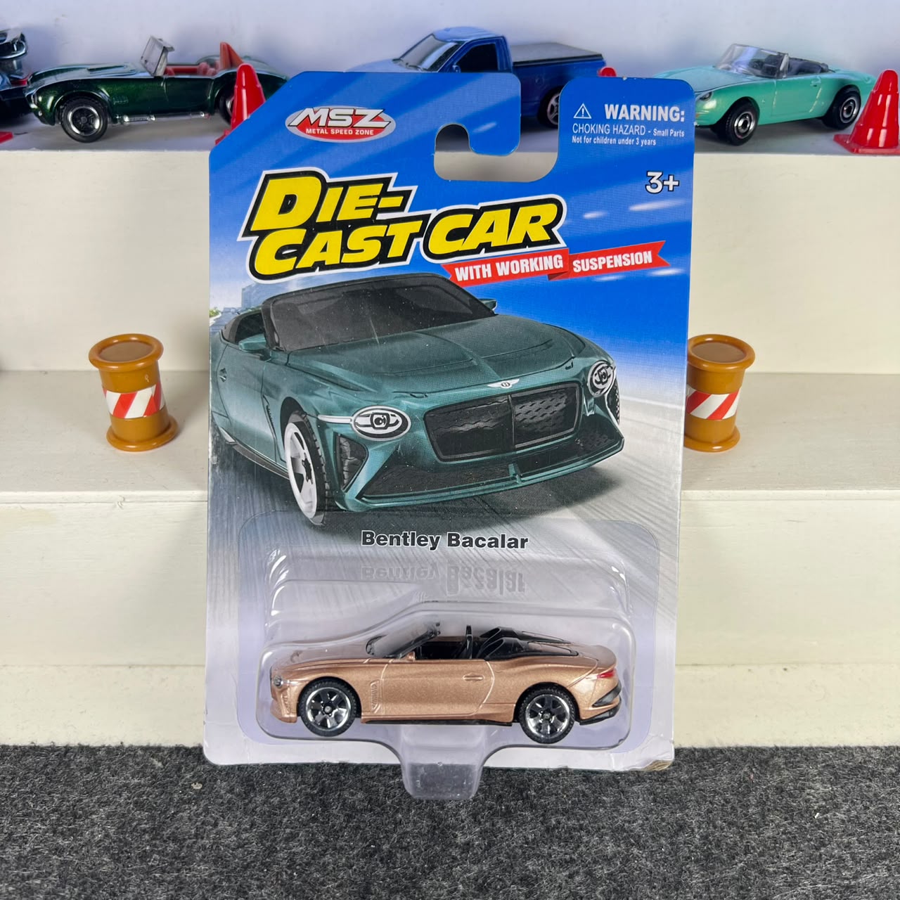 Bentley Bacalar gold diecast car with dark wheels, open-top cabin and working suspension – MSZ
