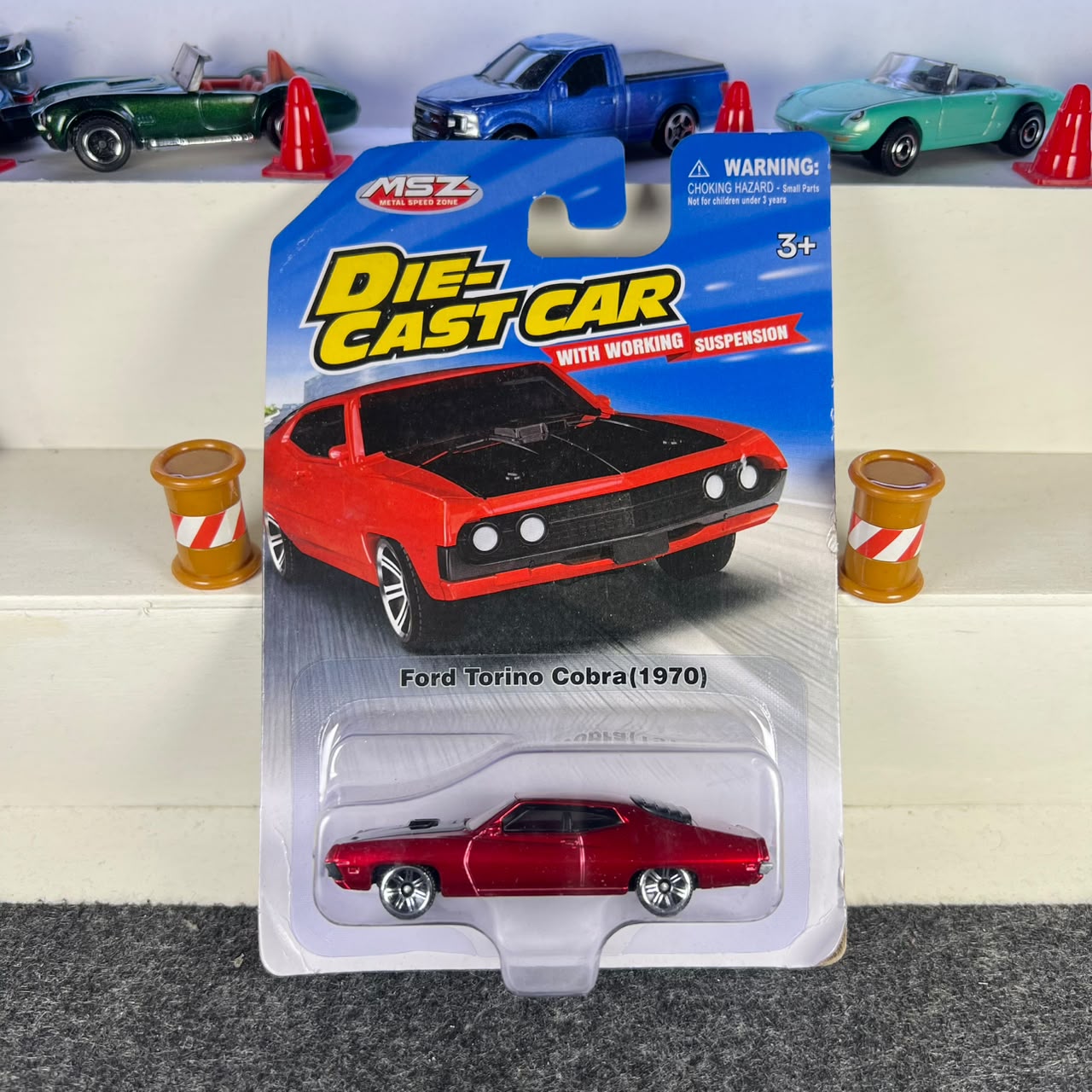 Ford Torino Cobra 1970 red diecast car with black hood, chrome-style wheels and working suspension – MSZ Ford Torino Cobra 1970 red diecast car with black hood, chrome-style wheels and working suspension – MSZ
