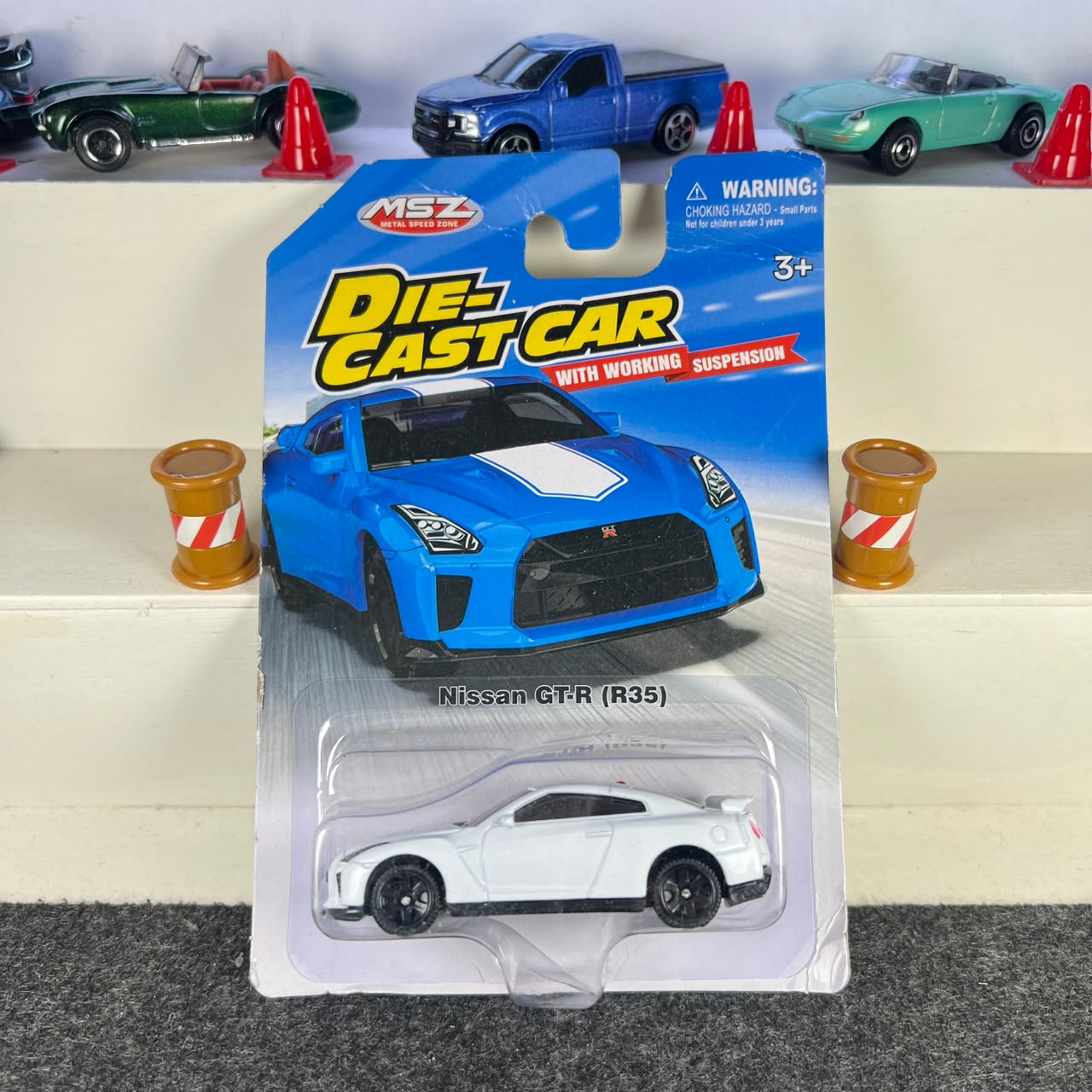 Nissan GT-R R35 white diecast car with black wheels, rear spoiler and working suspension – MSZ Nissan GT-R R35 white diecast car with black wheels, rear spoiler and working suspension – MSZ