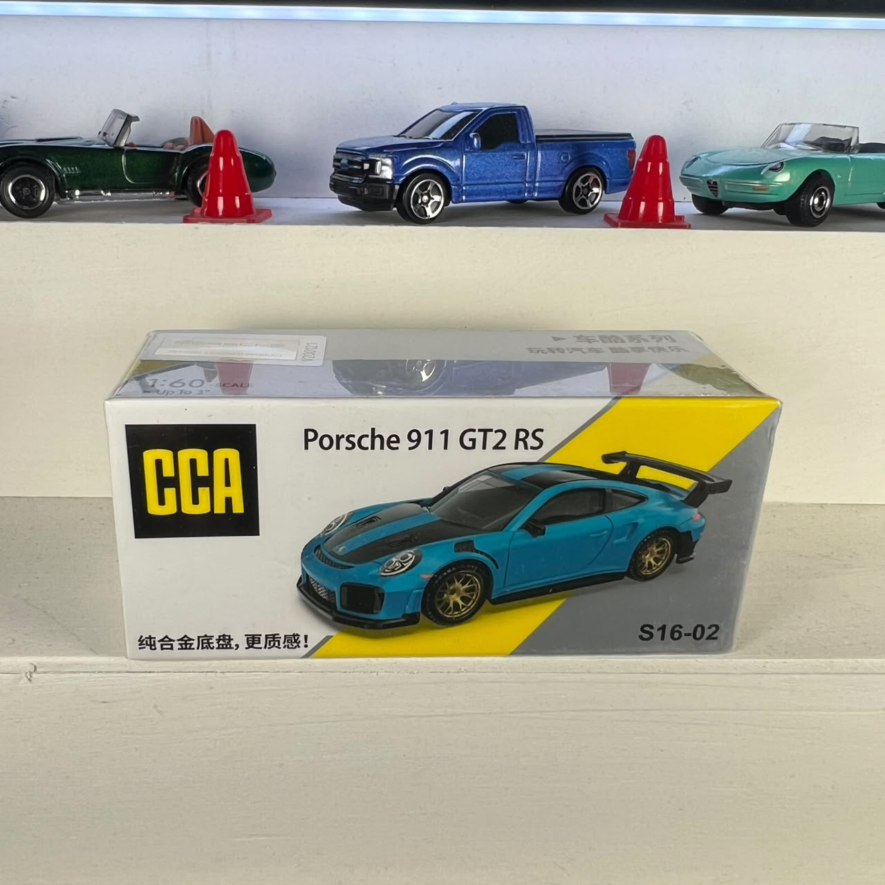 Porsche 911 GT2 RS blue 1:64 diecast car with gold wheels, large rear wing and alloy base – CCA Porsche 911 GT2 RS blue 1:64 diecast car with gold wheels, large rear wing and alloy base – CCA