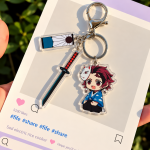 Tanjiro Kamado Demon Slayer acrylic character charm with sword, fox mask detail and decorative tag