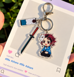 Tanjiro Kamado Demon Slayer acrylic character charm with sword, fox mask detail and decorative tag
