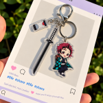 Tanjiro Kamado Demon Slayer acrylic character charm with sword, checkered haori and decorative tag