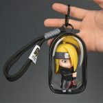 Deidara chibi mini figure with blonde hair and black Akatsuki-style cloak inside transparent black display case