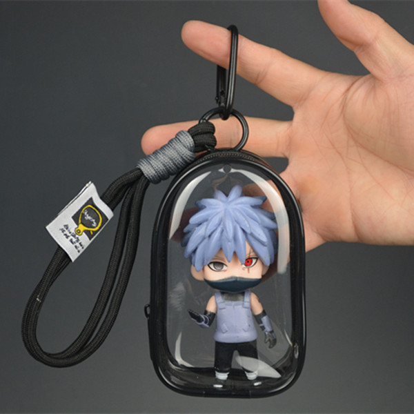 Kakashi Hatake chibi mini figure with silver hair, black mask and red Sharingan-style eye inside transparent black display case Kakashi Hatake chibi mini figure with silver hair, black mask and red Sharingan-style eye inside transparent black display case