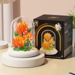 Thorn Chrysanthemum Building Blocks M5002 with orange flowers, transparent dust cover and light-up white base