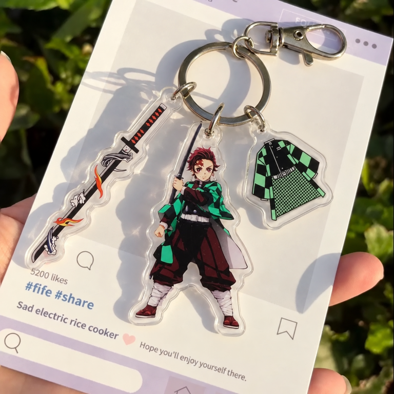 Tanjiro Kamado Sword Keyring with action-pose character, flame sword and checkered haori acrylic charms